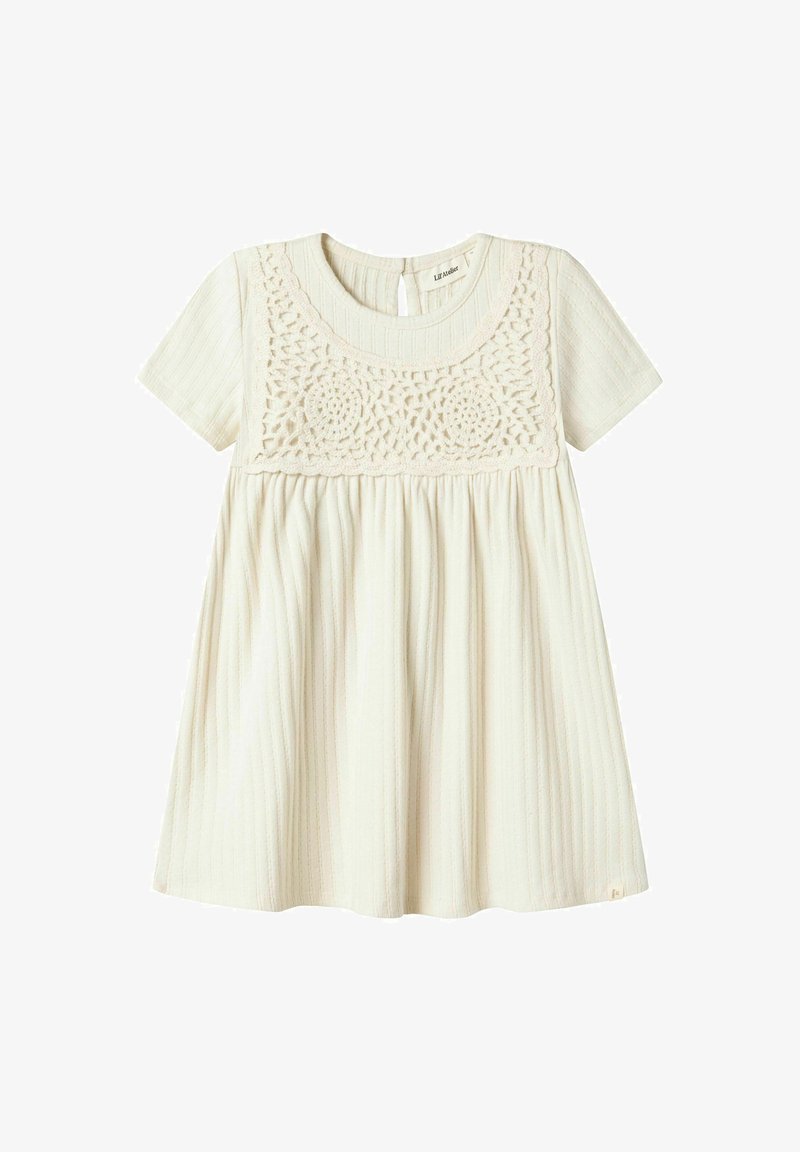 Light beige dress with short sleeves, ribbed texture, and lace crochet detailing at the bodice. Flared skirt and keyhole back closure.