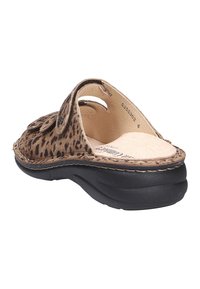 Leopard print slide sandal with a suede upper, a rounded toe, cutouts on the sides, and a black rubber sole for traction and comfort.