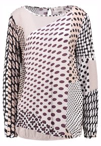 Blusa a maniche lunghe con un mix di pois e motivi geometrici nei toni crema, nero e bordeaux. Tessuto morbido con scollatura rotonda.