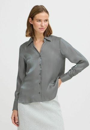 Camicia grigia in satin a maniche lunghe con taglio dritto, bottoni frontali e colletto classico. Tessuto liscio e leggero lucido.