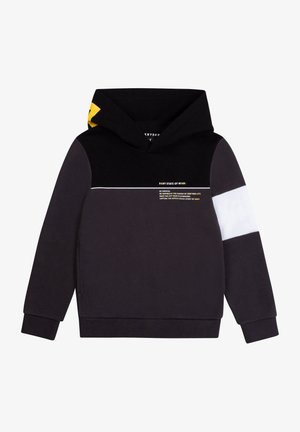 Sweat à capuche noir avec un accent jaune sur la capuche, design en blocs de couleurs avec des sections blanches et grises, et texte imprimé sur le devant.