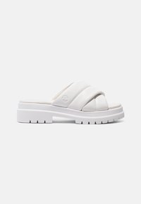 Witte schuifsandalen met dikke kruisbanden, textuurmateriaal, gevoerd voetbed en chunky witte rubberen zool met een gegroefd patroon.