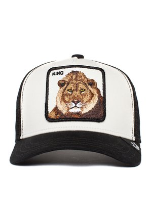 Black and white trucker cap featuring an embroidered lion patch with the word "KING" above. Soft fabric with a structured fit and a curved brim.