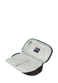 Czarny etui na zamek z jasnym wnętrzem, z kieszenią na zamek i elastycznymi paskami do organizacji. Zawiera metkę z logo.