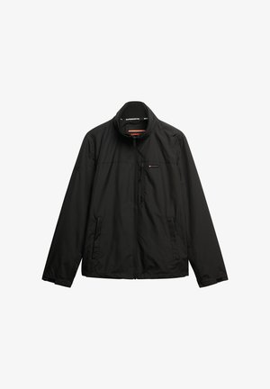 Black lightweight jacket with a stand collar, front zipper, and two side pockets. Features a subtle striped texture and branded accents.