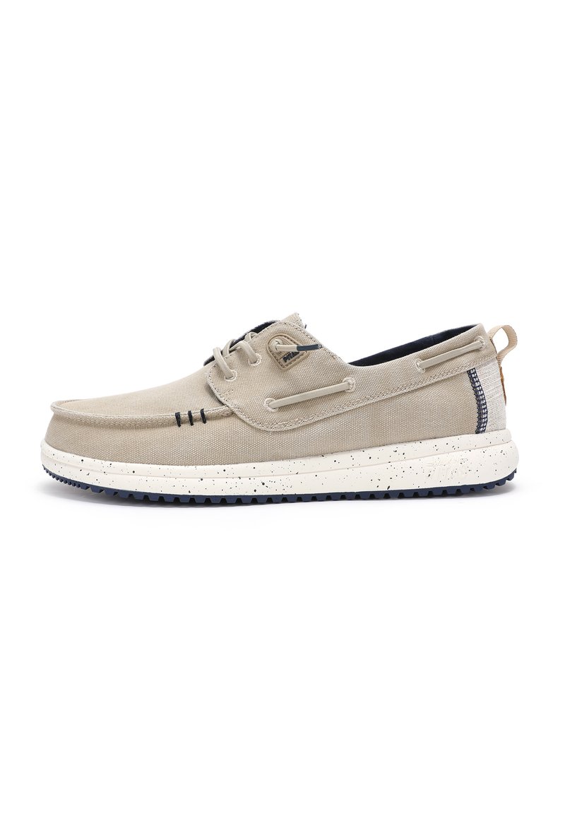 Beige canvas boat shoes with a rounded toe, contrasting navy interior, two pairs of eyelets, and a speckled white sole. Here's a textured design.
