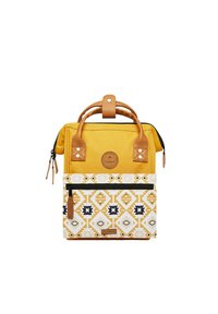 Yellow fabric backpack with brown leather accents, geometric patterned lower section, top handles, and a front zip pocket.