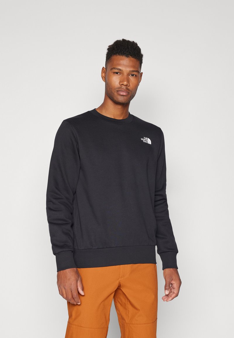 Schwarzer Sweatshirt aus Baumwolle, mit Rundhalsausschnitt, langen Ärmeln und einem kleinen weißen Logo auf der linken Brust. Strukturiertes Gewebe.