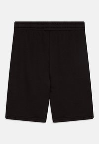 Shorts en coton noirs avec une taille élastique, texture lisse, longueur au genou, sans motifs ni accents visibles.