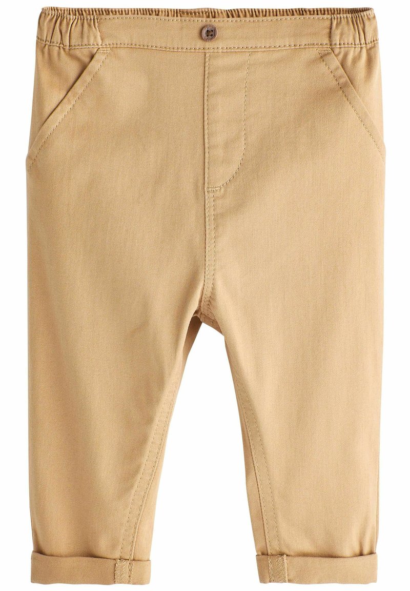 Pantalons en mélange de coton beige clair avec une taille élastique, des poches avant et des revers. Présentent des coutures nettes et une fermeture à bouton unique.