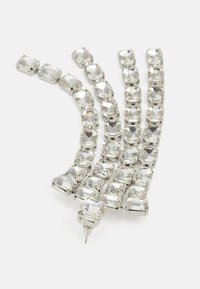 Käänteelne rhinestone ehete ketti, millel on neljakandilised, fassaaditud selged kivid hõbedase tooni metallis, ühes otsas kinnitamiseks mõeldud prell.