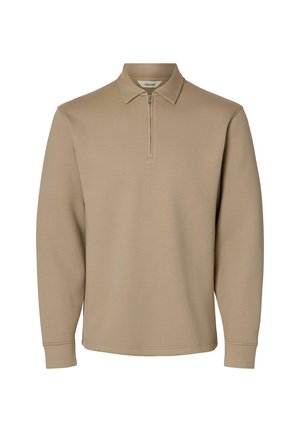 Jersey beige de manga larga con cremallera frontal parcial y cuello clásico, confeccionado en tela suave.