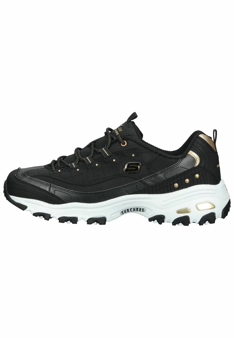 Baskets Skechers noires et dorées avec semelle épaisse blanche, fermeture à lacets à l'avant et semelle extérieure texturée visible de profil.