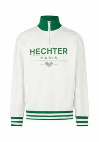 Witte sweatshirt met groene accenten, halve ritskraag, en groene/witte gestreepte manchetten en zoom. Bevat de tekst "HECHTER PARIS" en een tennisafbeelding.