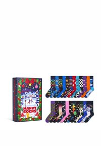 Caja de regalo compacta que contiene calcetines de colores con patrones variados, incluyendo lunares, animales y formas geométricas.