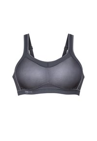 Brassière de sport noire avec panneaux en mesh, larges bretelles et bande élastique lisse. Présente un design structuré et une étiquette de marque à l'avant.