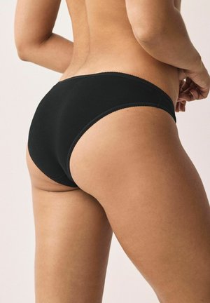 Zwarte katoen hipsteronderbroek met een naadloos ontwerp, zachte textuur en een dunne, scalloped tailleband, die een soepele silhoeët benadrukt.