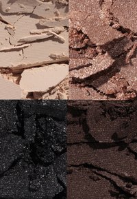 Four squares of crushed cosmetics: top left is matte beige, top right is shimmery bronze, bottom left is glittery black, bottom right is dark brown.