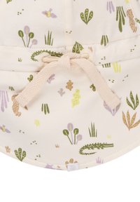 Baumwoll-Hut in Creme mit bunten Blumen- und Reptilmustern. Mit einem strapazierfähigen Stoffband vorne gebunden.
