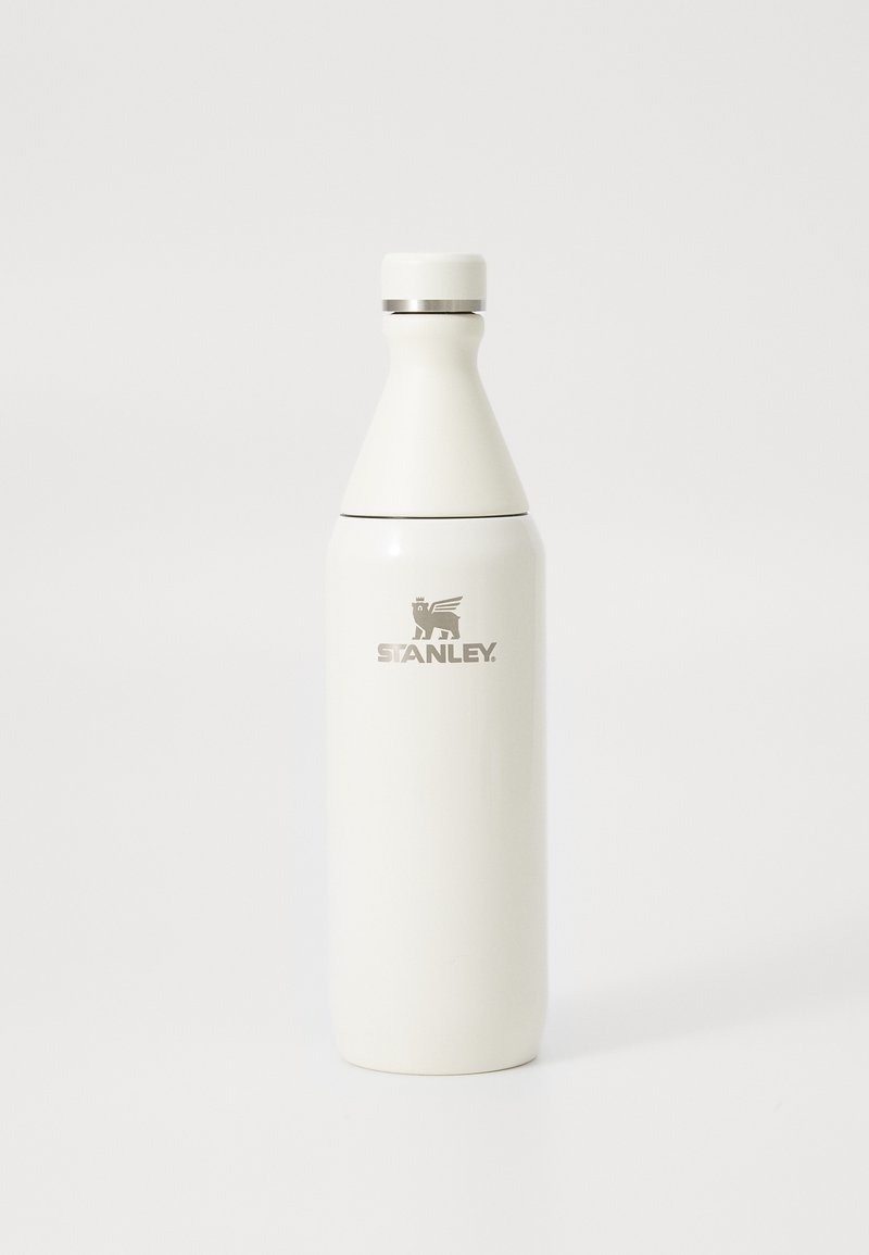 White stainless steel Stanley insulated water bottle with logo, featuring a tapered top and screw-on cap.
