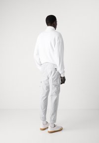 BOSS URBANEX - Pantaloni cargo - light pastel grey