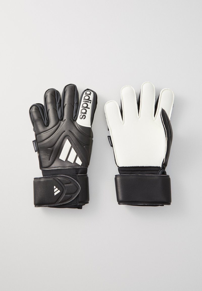 Gant de gardien de but en noir et blanc. Paume en latex texturé avec des articulations rembourrées, sangle de poignet élastique et détails du logo Adidas.