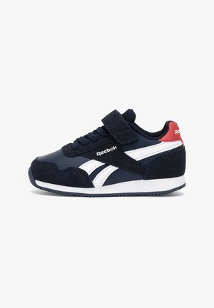 Granatowo-białe dziecięce buty sportowe Reebok na rzep, z czerwonym detalem na pięcie i gumową podeszwą, widok z boku.