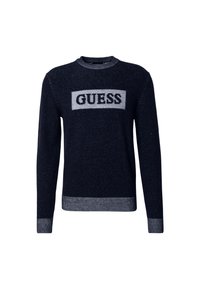 Jersey azul marino con cuello redondo, que presenta un logo gris de 'GUESS' en el pecho y puños y dobladillo de rayas acanaladas.