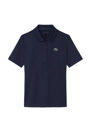Polo blu navy a maniche corte con abbottonatura a tre bottoni e un piccolo logo verde di coccodrillo sul petto a sinistra.