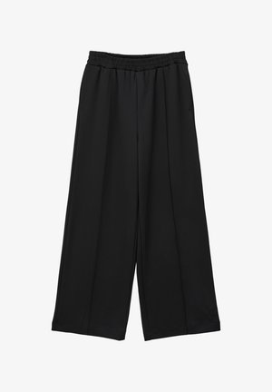 Pantalons noirs à jambe large en tissu doux, dotés d'une taille élastique et de deux poches latérales, avec une surface lisse et sans texture.