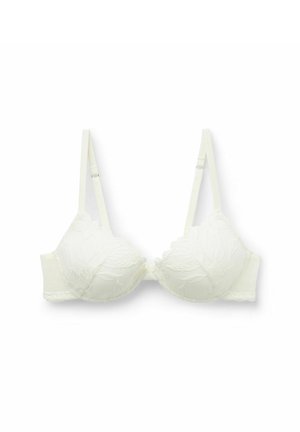 Reggiseno bianco in pizzo con coppe sagomate e spalline regolabili. Presenta ricami floreali e un bordo ondulato lungo la fascia e il ferretto.
