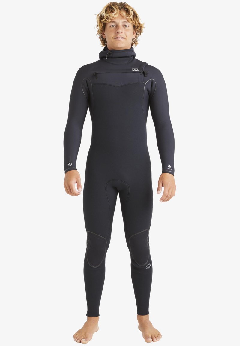 Black wetsuit with a high collar, smooth texture, and seam details. Features reinforced knee patches and minimal branding on chest.