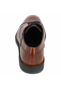 Stivale alla caviglia in pelle marrone con finitura liscia, punta arrotondata e suola in gomma nera. Presenta cuciture sottili e un colletto testurizzato.