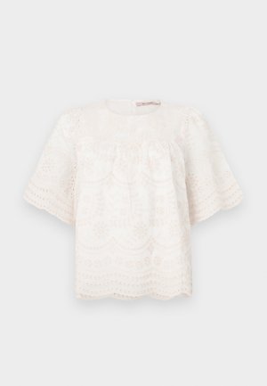 Bluză albă brodată cu mâneci scurte, puffate, tiv ondulat și modele florale. Țesătură moale și texturată. Decolteu rotund.