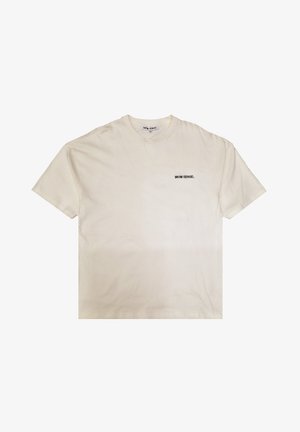 Cremefarbenes Baumwoll-T-Shirt mit lockerem Schnitt, mit einem kleinen schwarzen Textlogo "9N1M SENSE." auf der linken Brustseite.