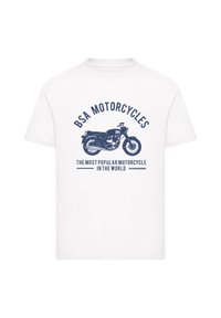 White cotton t-shirt featuring a navy print of a motorcycle and the text "BSA MOTORCYCLES" above and "THE MOST POPULAR MOTORCYCLE IN THE WORLD" below.