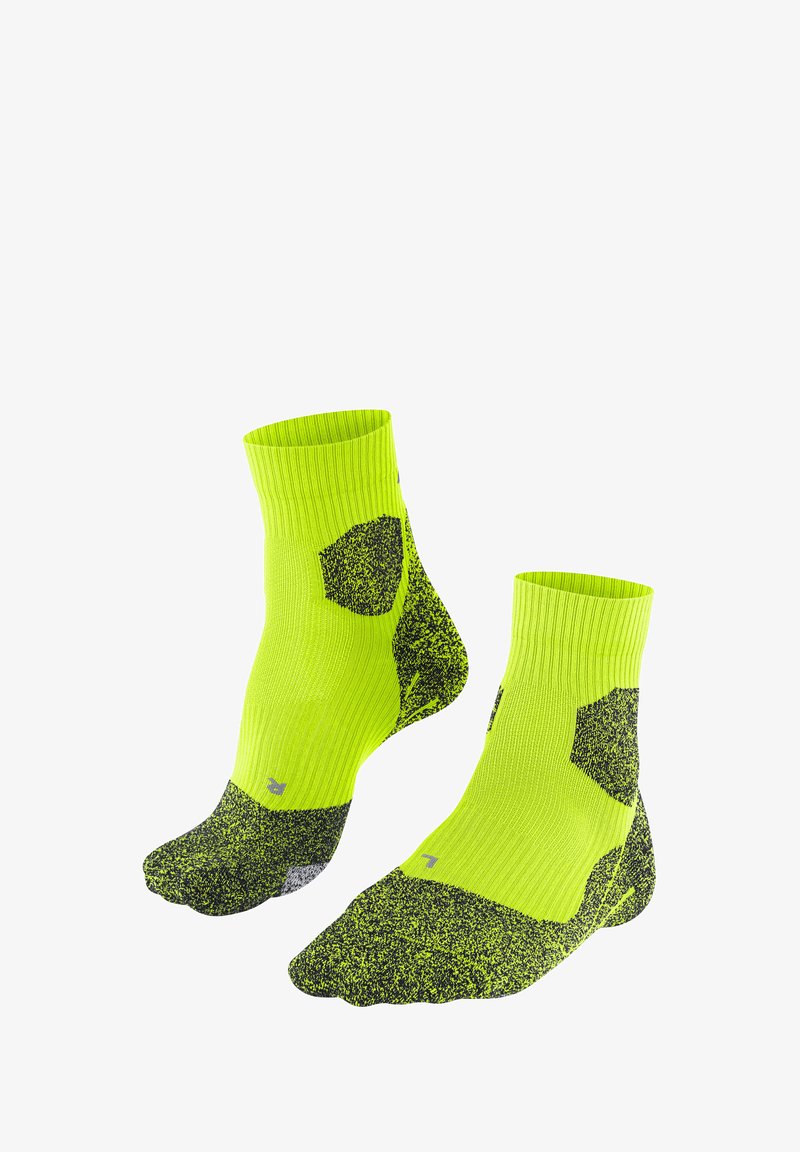 Neonowo-żółte skarpetki do kostki z czarną nakrapianą teksturą i sześciokątnymi akcentami. Prążkowany mankiet i wzmocniony palec dla większej wytrzymałości.