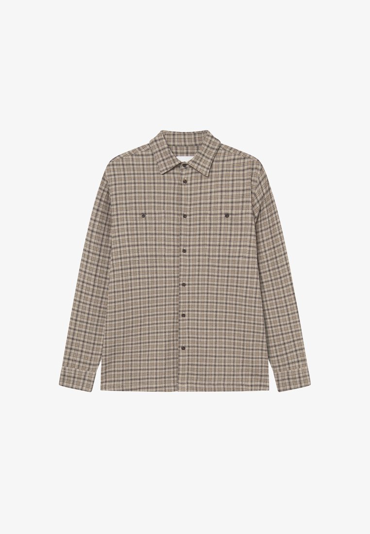 Langermet rutete skjorte i beige og brune toner. Har en knappesting foran, krage og to brystlommer med knappelukking.