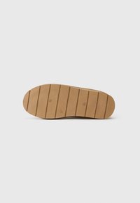 Flat tan shoe sole with horizontal grooves, size 37 marked in the center, shown against a plain white background.