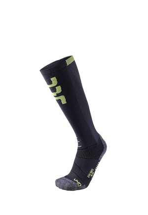 Black and dark gray knee-high sock with green accents and text branded "UYN" designed for sports or compression wear.