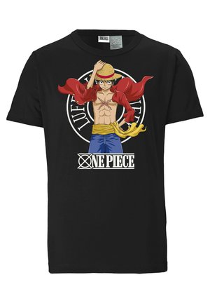 Black cotton t-shirt featuring a colorful graphic of a character in a red cape and straw hat, with "ONE PIECE" text below the design.