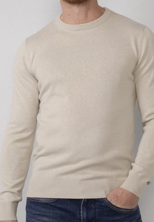 Stickad tröja - beige