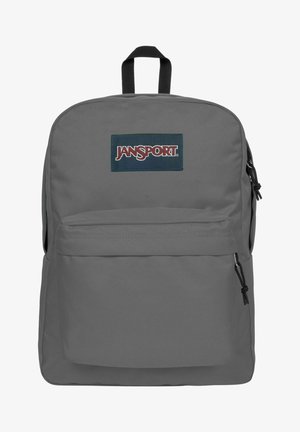 Grå Jansport rygsæk med et stort hovedrum, frontlomme og justerbare stropper. Har et blåt logomærke på forsiden.
