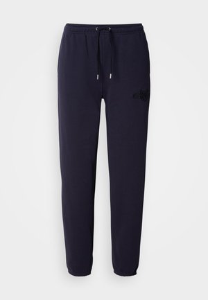 Navy blue sweatpants made of soft fabric, featuring an elastic waistband with a drawstring, and an embroidered logo on one leg.