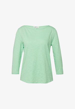 Hellgrünes Langarm-Damenhemd mit rundem Ausschnitt, dezenter Textur und kleinem Markenschildchen am Innenkragen.