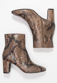 Brown and black snakeskin ankle boots with a pointed toe, side zipper, and block heel, featuring a glossy texture and intricate pattern.