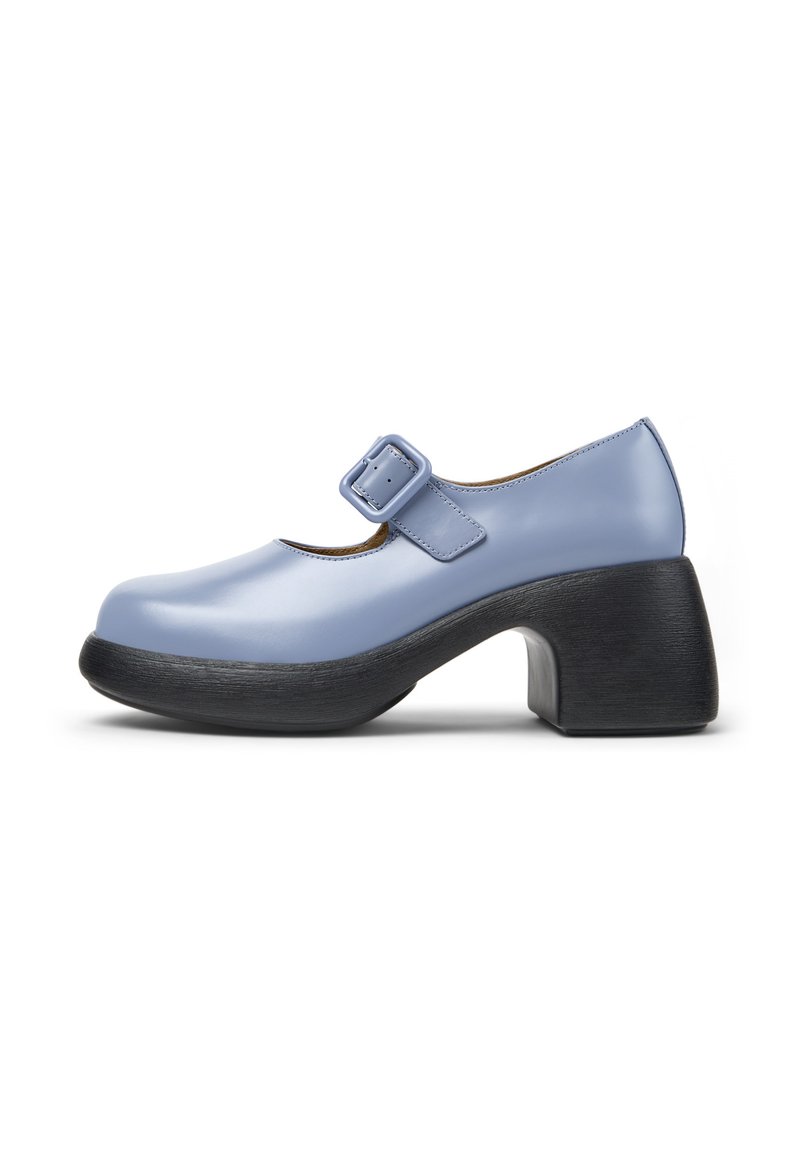 Light blue Mary Jane shoe with a large buckle and rounded toe, featuring a chunky black block heel and sole.