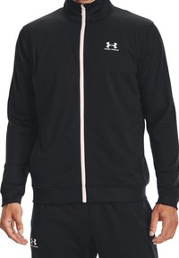 Black zip-up jacket made of smooth, lightweight fabric. Features a high collar, pale pink zipper, and Under Armour logo on the chest.