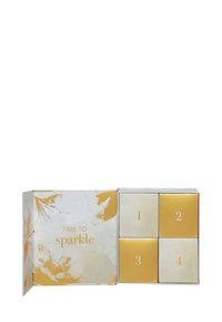 Scatola regalo con quattro scomparti, in una combinazione di colori oro e crema, con finitura lucida, che presenta il testo "È tempo di brillare" e accenti di design floreale.