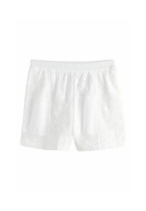 Weiße Spitzenshorts mit elastischem Bund und Blumenmuster auf dem Stoff, gezeigt vor einem weißen Hintergrund.